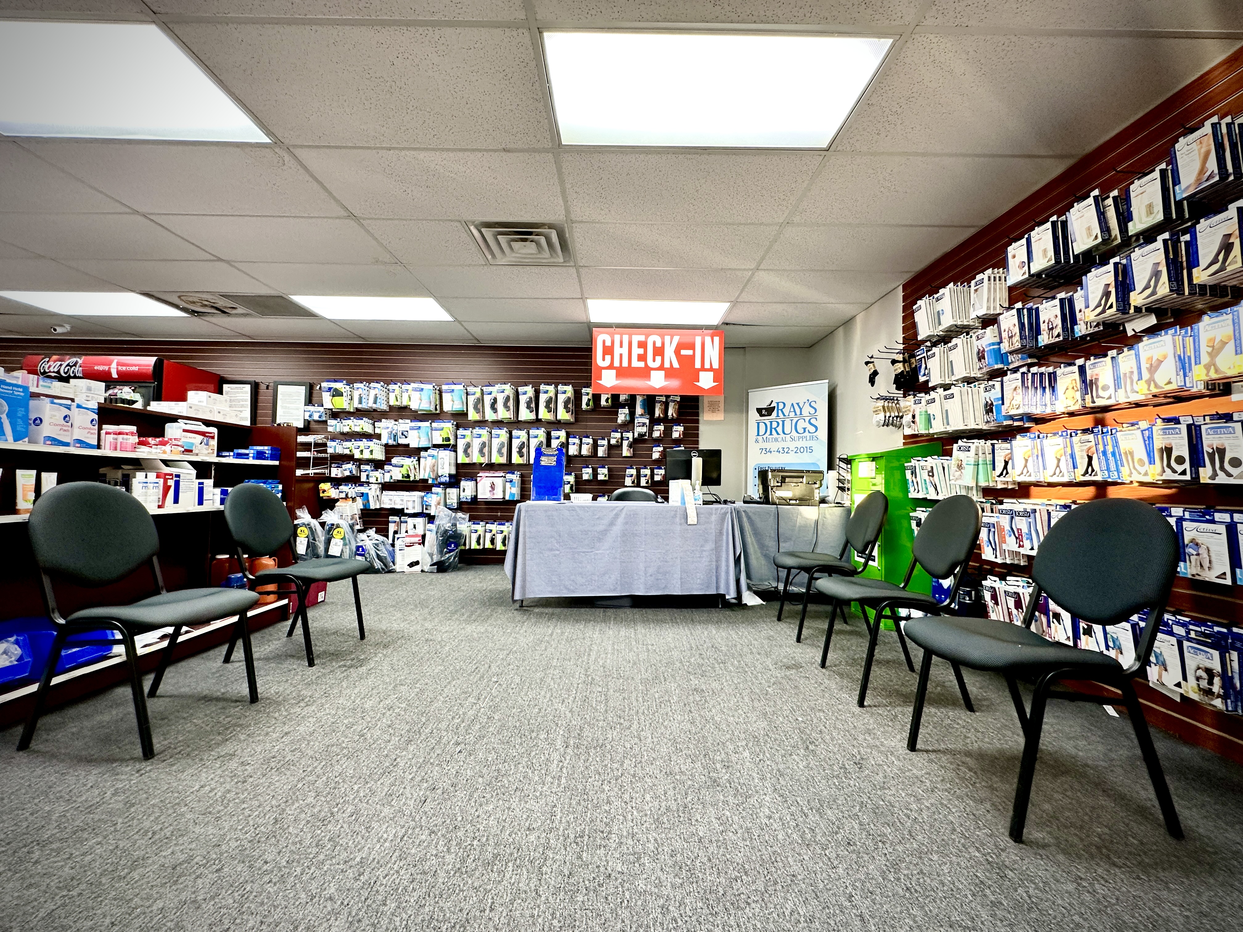 Pharmacist consulting with a patient at Ray's Drugs